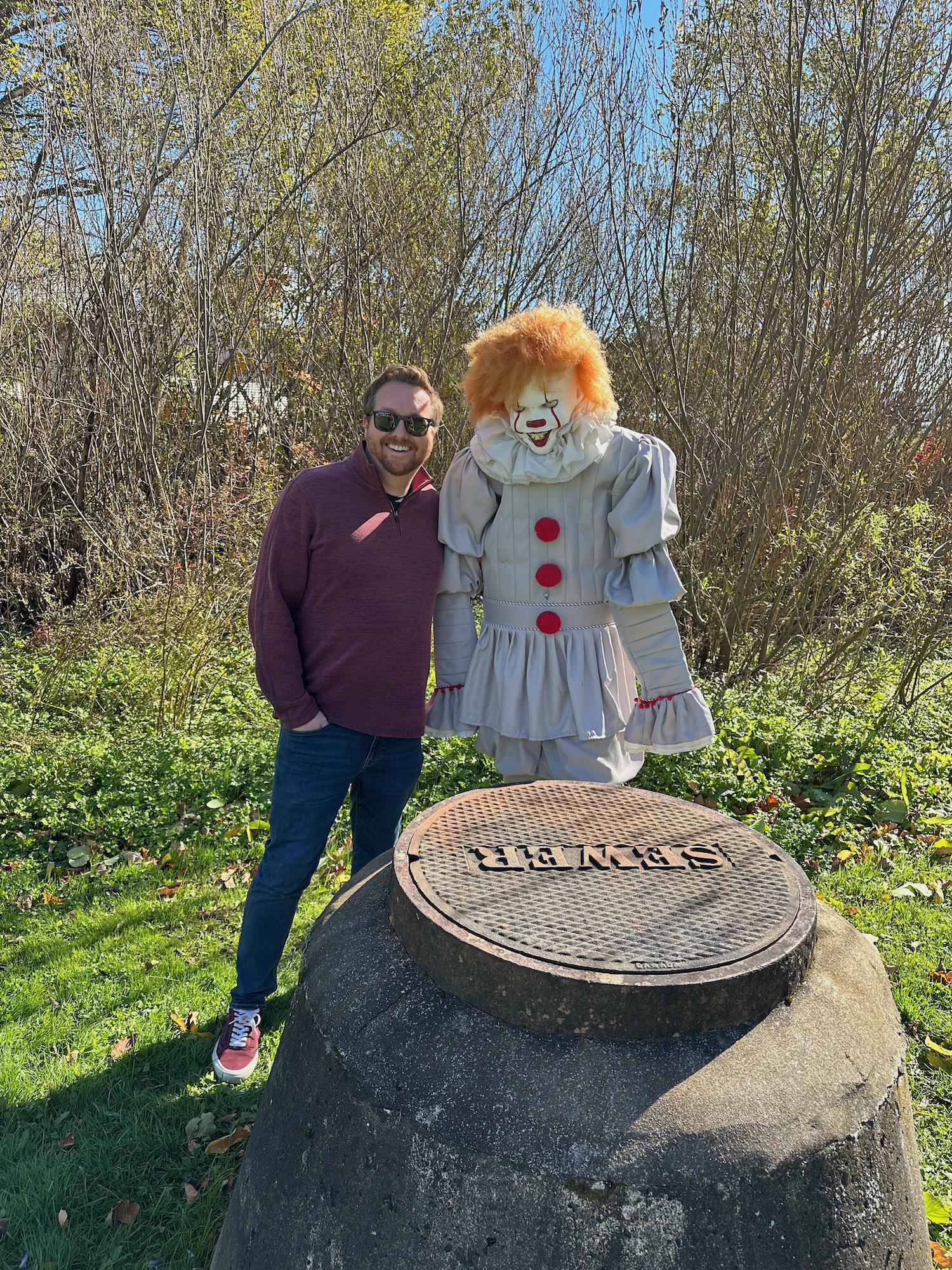 Me posing with Pennywise the Clown on a Stephen King tour in Bangor, Maine